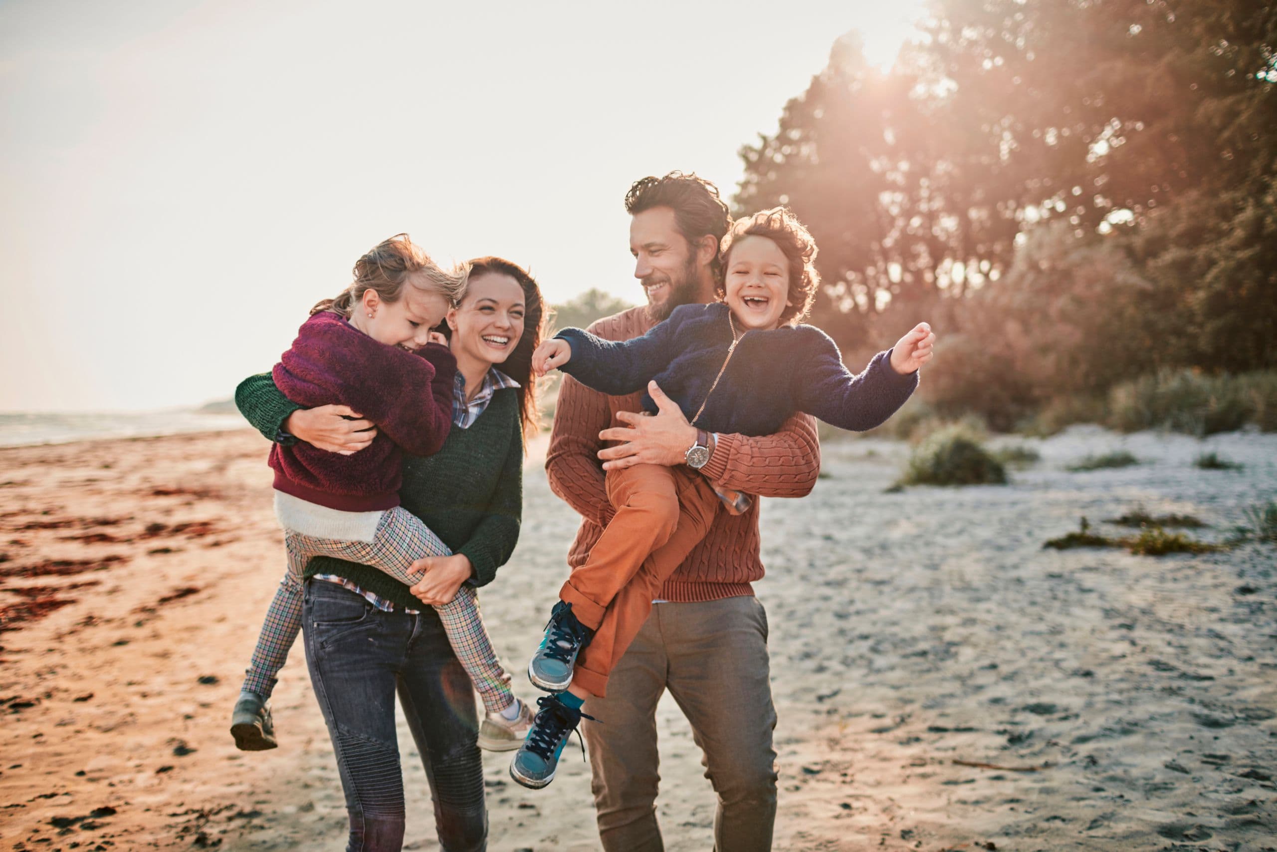 Close up of a happy family enjoying time on the beach